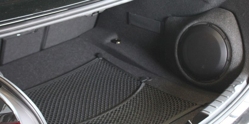 Subwoofer(s) in the left and right sides of the trunk
