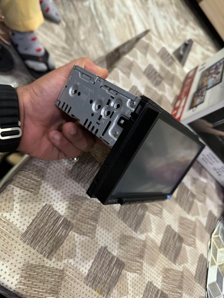 Sony XAV AX4000 in hands side view